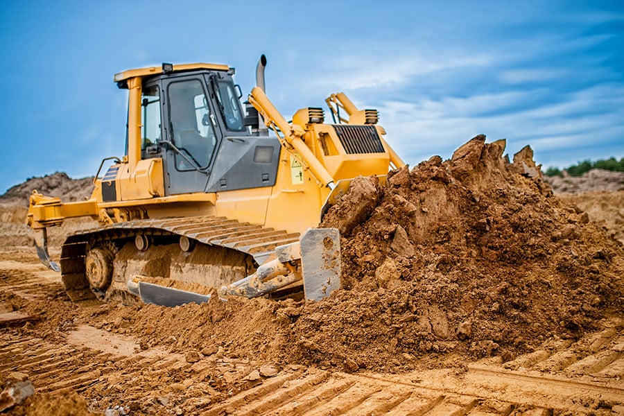 a tractor parked in the dirt