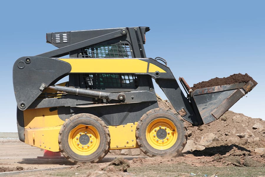 a tractor parked in the dirt